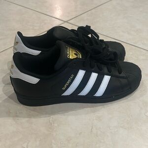 Adidas Superstars black sneakers